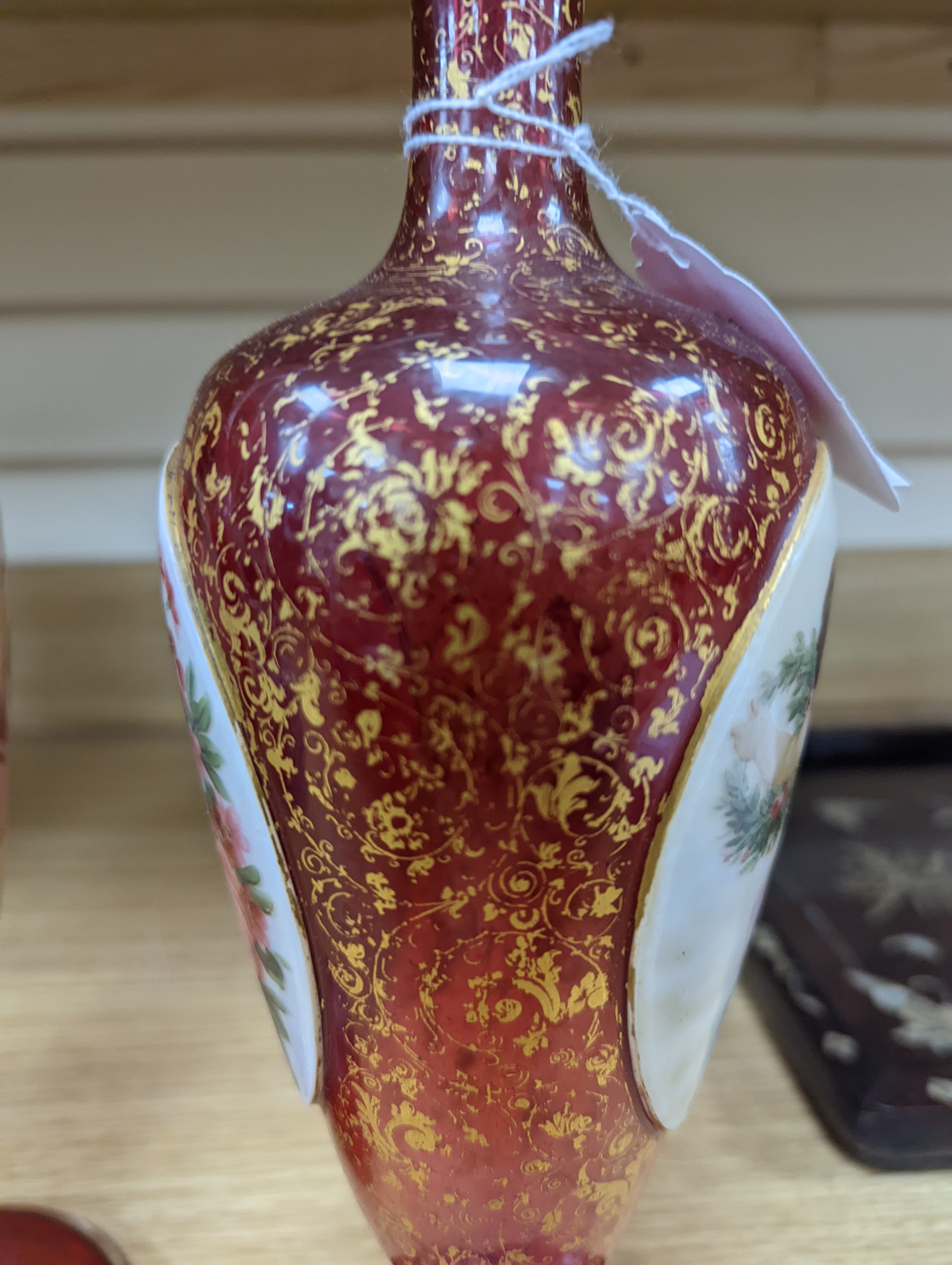 A pair of 19th century Bohemian enamelled and overlaid ruby glass vases 36cm